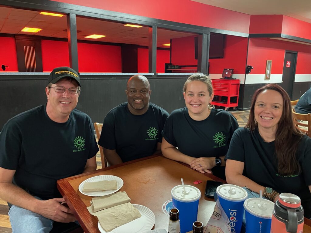 PRA employees eating together at lunch.